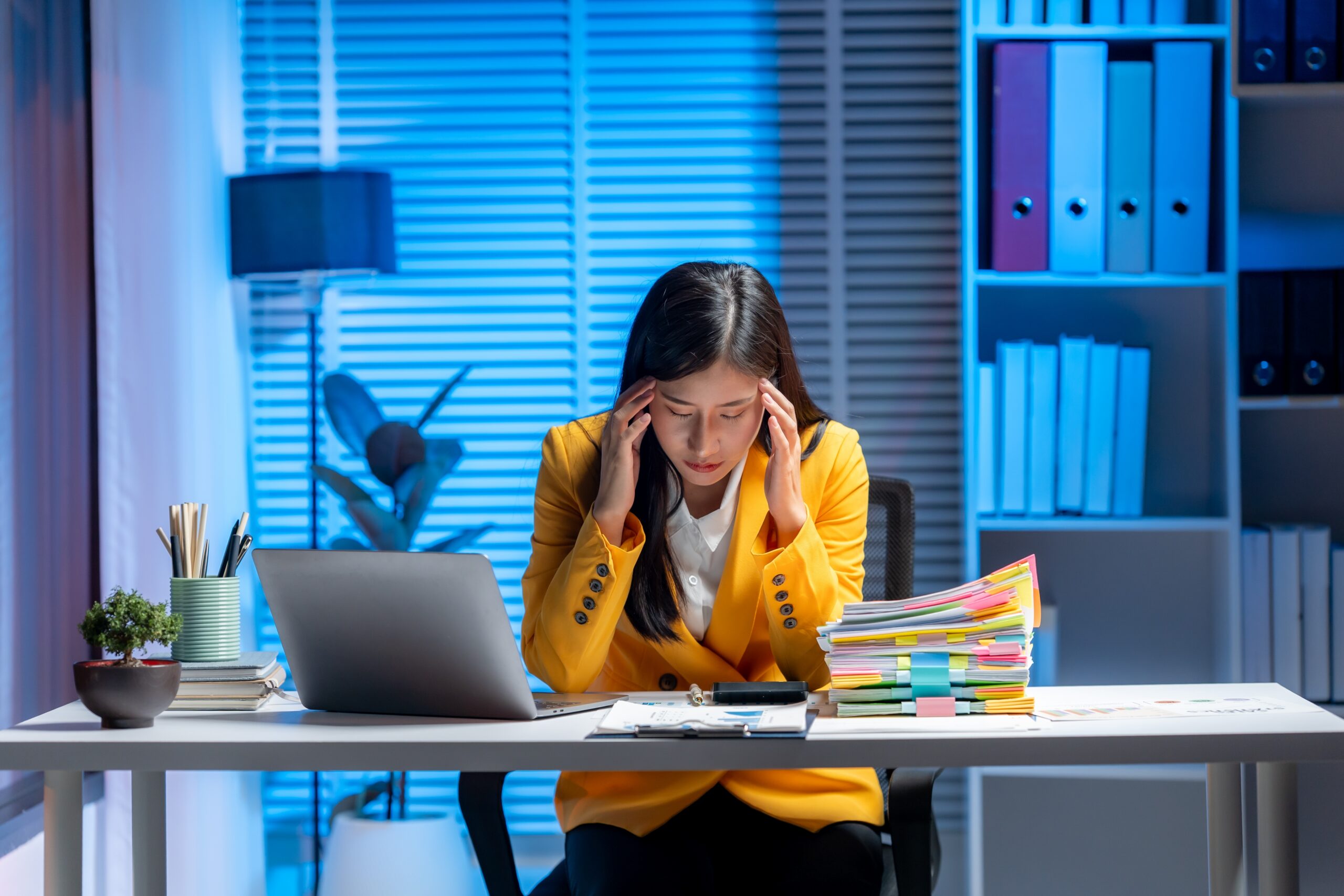 Women at desk, stressed, tired, strained