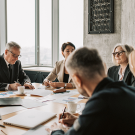 group of executives sitting at conference table