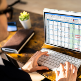 auditor analyzing spreadsheets