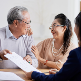 An older couple meeting with an advisor for estate planning
